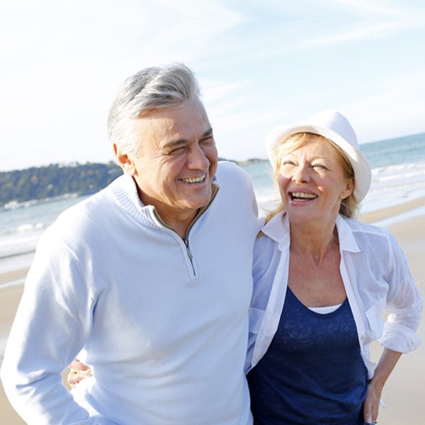 An elderly couple by the beach